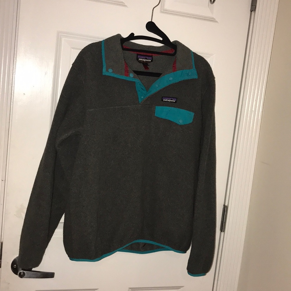 dark grey Patagonia pullover with blue lining